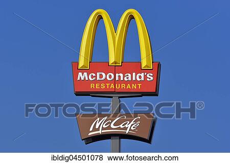 McDonalds sign against a blue sky View Large Photo Image Stock Photo - McDonalds sign against a blue sky. Fotosearch
