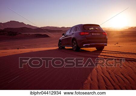 Mercedes Benz GLC250 SUV on dirt road, desert, sunset, Wadi Rum, Jordan, Asia View Large Photo Image Picture - Mercedes Benz GLC250 SUV on dirt road, desert, sunset, Wadi Rum, Jordan, Asia. Fotosearch