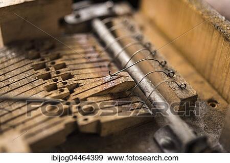 Stock Photo - Metal springs on wooden valves are tested, barrel organ manufacture, Grassau, Upper Bavaria, Bavaria, Germany, Europe. Fotosearch