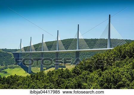 Millau Viaduct, A75 motorway, built by Michel Virlogeux and Norman Foster, located between Causses de Sauveterre and Causses du Larzac above Tarn River, Natural Regional Park of Grands Causses, Aveyron, France, Europe View Large Photo Image Stock Photography - Millau Viaduct, A75 motorway, built by Michel Virlogeux and Norman Foster, located between Causses de Sauveterre and Causses du Larzac above Tarn River, Natural Regional Park of Grands Causses, Aveyron, France, Europe. Fotosearch
