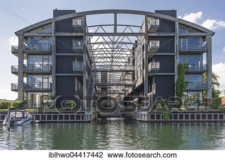 Stock Image - Modern residential complex on waterfront, Christianshavns Canal, Copenhagen, Denmark, Europe. Fotosearch