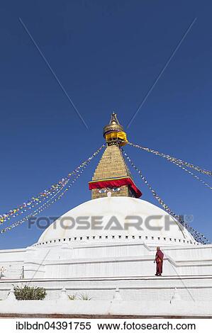 Monk at Buddhist stupa, Boudhanath stupa, Boudhanath, Kathmandu, Nepal, Asia View Large Photo Image Stock Photography - Monk at Buddhist stupa, Boudhanath stupa, Boudhanath, Kathmandu, Nepal, Asia. Fotosearch