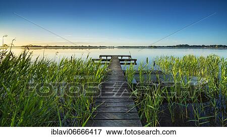 Morning atmosphere at the Schaalsee, wooden footbridge in the reeds, biosphere reserve Schaalsee, Mecklenburg-Western Pomerania, Germany, Europe View Large Photo Image Stock Photo - Morning atmosphere at the Schaalsee, wooden footbridge in the reeds, biosphere reserve Schaalsee, Mecklenburg-Western Pomerania, Germany, Europe. Fotosearch