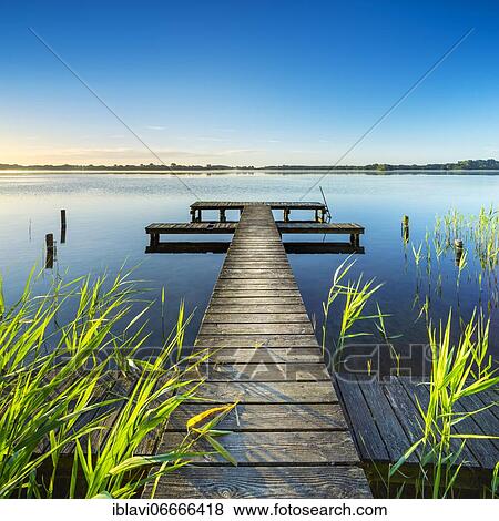 Morning atmosphere at the Schaalsee, wooden footbridge in the reeds, biosphere reserve Schaalsee, Mecklenburg-Western Pomerania, Germany, Europe View Large Photo Image Stock Photo - Morning atmosphere at the Schaalsee, wooden footbridge in the reeds, biosphere reserve Schaalsee, Mecklenburg-Western Pomerania, Germany, Europe. Fotosearch