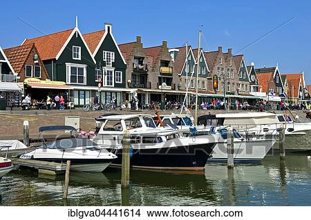 Motorboats at dock, houses along harbor, Volendam, North Holland Province, Holland, The Netherlands, Europe View Large Photo Image Picture - Motorboats at dock, houses along harbor, Volendam, North Holland Province, Holland, The Netherlands, Europe. Fotosearch