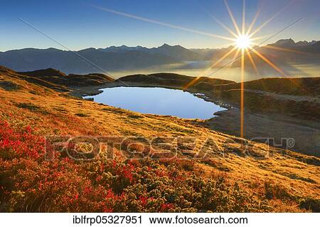 Stock Image - Mountain lake, Pascuminersee, Buendner Alps, Graubuenden, Switzerland, Bündner Alps, Europe. Fotosearch