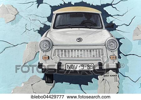 Mural, Test the Best, Trabi breaking through wall, artist Birgit Kinder, East Side Gallery, Berlin, Germany, Europe View Large Photo Image Stock Photo - Mural, Test the Best, Trabi breaking through wall, artist Birgit Kinder, East Side Gallery, Berlin, Germany, Europe. Fotosearch