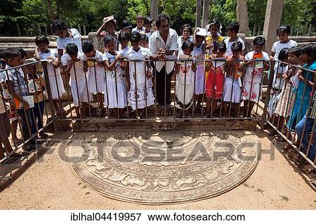 Native people observing moonstone at Mahasena Palace, Abhayagiri Vihara monastery complex, Sacred City of Anuradhapura, North Central Province, Sri Lanka, Asia View Large Photo Image Stock Photo - Native people observing moonstone at Mahasena Palace, Abhayagiri Vihara monastery complex, Sacred City of Anuradhapura, North Central Province, Sri Lanka, Asia. Fotosearch