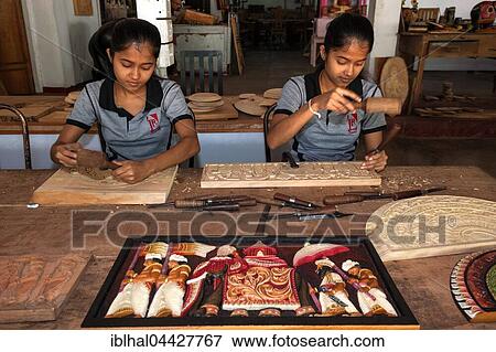 Native Sinhalese girls carving traditional wooden pictures, wood carving, Dambulla, Central Province, Sri Lanka, Asia View Large Photo Image Stock Photo - Native Sinhalese girls carving traditional wooden pictures, wood carving, Dambulla, Central Province, Sri Lanka, Asia. Fotosearch