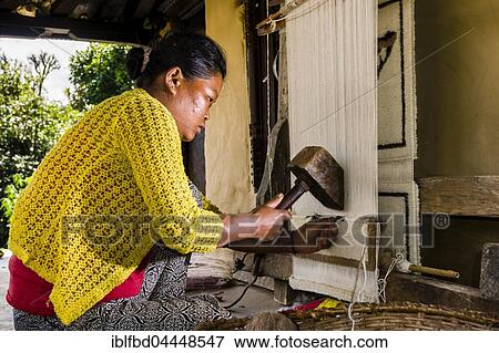 Native woman knotting carpet using sheep's wool in front of house, Ghandruk, Kaski District, Nepal, Asia View Large Photo Image Stock Photo - Native woman knotting carpet using sheep's wool in front of house, Ghandruk, Kaski District, Nepal, Asia. Fotosearch