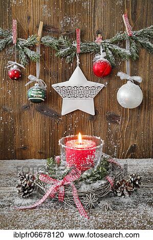 Stock Image - Natural Advent decoration with candle. Fotosearch