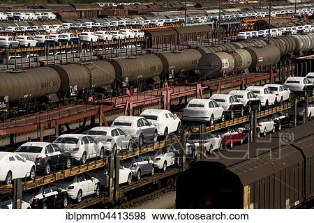 New cars on railway transport wagons, marshalling yard Munich-Allach, Munich, Germany, Europe View Large Photo Image Stock Photo - New cars on railway transport wagons, marshalling yard Munich-Allach, Munich, Germany, Europe. Fotosearch