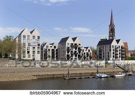 Stock Photo - New residential quarter in front of Stephani, gabled houses, Weser promenade, Stephaniviertel, Bremen, Germany, Europe. Fotosearch