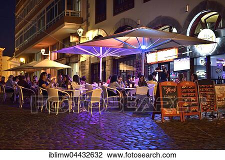 Nightlife, patrons in the restaurant, Puerto de la Cruz, Tenerife, Canary Islands, Spain, Europe View Large Photo Image Stock Image - Nightlife, patrons in the restaurant, Puerto de la Cruz, Tenerife, Canary Islands, Spain, Europe. Fotosearch