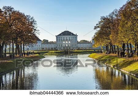 Stock Photograph - Nymphenburg Palace, east side reflected in the lock channel, autumn, Munich, Upper Bavaria, Bavaria, Germany, Europe. Fotosearch
