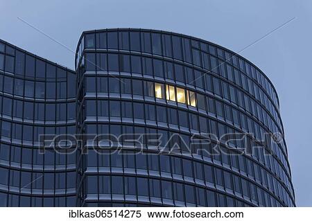 Office tower with a single illuminated window, evening, symbolic image for home office, Corona pandemic, Düsseldorf, North Rhine-Westphalia, Germany, Europe View Large Photo Image Stock Photography - Office tower with a single illuminated window, evening, symbolic image for home office, Corona pandemic, Düsseldorf, North Rhine-Westphalia, Germany, Europe. Fotosearch