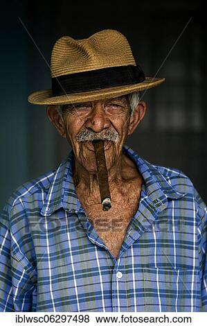 Stock Photo - Old man, Cuban with straw hat and cigar, portrait, Cuba, Central America. Fotosearch