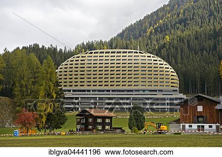 Old Swiss farmhouse in front of modern InterContinental Davos Hotel, Davos, Grisons, Switzerland, Europe View Large Photo Image Stock Photograph - Old Swiss farmhouse in front of modern InterContinental Davos Hotel, Davos, Grisons, Switzerland, Europe. Fotosearch