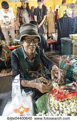 Old woman, Thai woman sells flowers and flower chains at the Night Market, Krabi Town, Krabi Province, Thailand, Asia View Large Photo Image Stock Image - Old woman, Thai woman sells flowers and flower chains at the Night Market, Krabi Town, Krabi Province, Thailand, Asia. Fotosearch