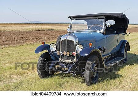 Oldtimer Citroen B10 in hay field, Torpedo Commerciale, built in 1925. 4-cylinder inline engine, engine capacity 1470 cc, 20 PS, all-steel body View Large Photo Image Picture - Oldtimer Citroen B10 in hay field, Torpedo Commerciale, built in 1925. 4-cylinder inline engine, engine capacity 1470 cc, 20 PS, all-steel body. Fotosearch