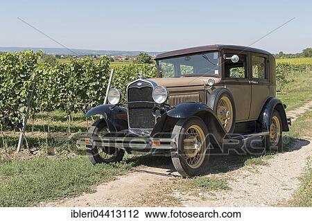 Stock Image - Oldtimer Ford A, built in 1930, 4 cylinders, displacement 3500 cc, weight 1275 kg, 2x3 forward gears, 40 hp, 95 km / h. Fotosearch
