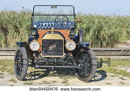 Oldtimer Ford T Runabout, built in 1913, 4 cylinders, displacement 2700 cc, 2 forward gears, semi-automatic, 20 hp, 72 km / h View Large Photo Image Stock Photograph - Oldtimer Ford T Runabout, built in 1913, 4 cylinders, displacement 2700 cc, 2 forward gears, semi-automatic, 20 hp, 72 km / h. Fotosearch