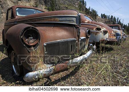 Stock Photo - Oldtimer, Studebaker Champion, scrap cars, near Spokane, Washington, USA, North America. Fotosearch