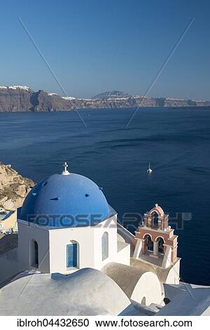 Stock Image - Orthodox church with blue dome and bell tower, Oia, Santorini, Cyclades, Greece, Europe. Fotosearch