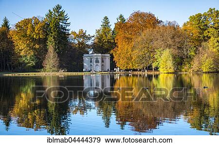 Stock Photo - Pagodenburg reflected in Lake Pagodenburg, Nymphenburg Castle Park, autumn, Munich, Upper Bavaria, Bavaria, Germany, Europe. Fotosearch