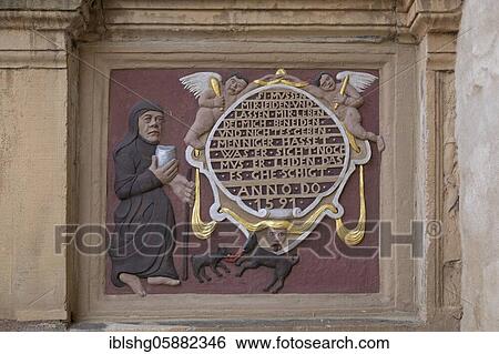 Stock Photograph - Painted relief on the facade of the Tempelhaus, market place, Hildesheim, Lower Saxony, Germany, Europe. Fotosearch