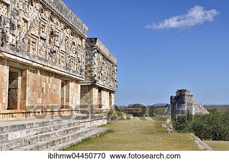 Stock Image - Palacio del Gobernador, governor's palace, left, and pyramid del Adivino, magician's pyramid, Maya city of Uxmal, Yucatan, Mexico, Central America. Fotosearch