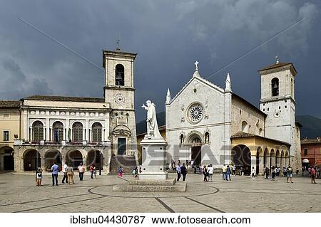 Stock Photo - Palazzo Comunale Town Hall and Basilica di San Benedetto, stormy sky, Norica, Perugia, Umbria, Italy, Europe. Fotosearch