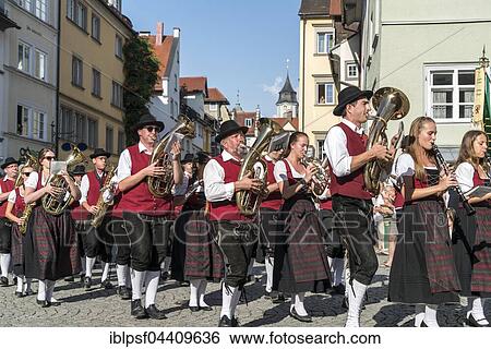 Stock Photograph - Parade with musical band in traditional costumes, Lindau, Lake Constance, Bavaria, Germany, Europe. Fotosearch