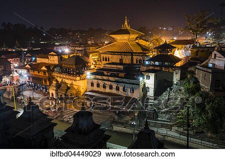 Pashupatinath temple with gaths at banks of Bagmati River, illuminated at night, Kathmandu, Kathmandu District, Nepal, Asia View Large Photo Image Stock Photo - Pashupatinath temple with gaths at banks of Bagmati River, illuminated at night, Kathmandu, Kathmandu District, Nepal, Asia. Fotosearch