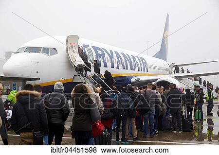 Passengers boarding Boeing plane in bad weather, Ryanair, Frankfurt-Hahn Airport, Frankfurt, Rhineland-Palatinate, Germany, Europe View Large Photo Image Stock Photo - Passengers boarding Boeing plane in bad weather, Ryanair, Frankfurt-Hahn Airport, Frankfurt, Rhineland-Palatinate, Germany, Europe. Fotosearch