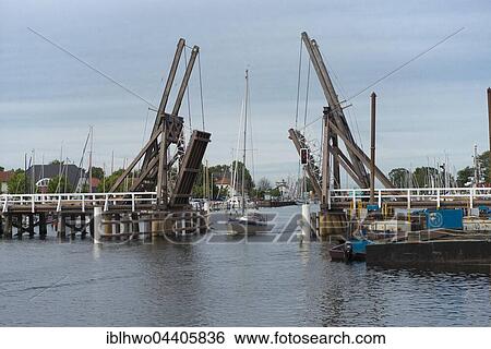 Past bascule bridge spanning the Ryck, Greifswald, Mecklenburg-Western Pomerania, Germany, Europe View Large Photo Image Stock Photograph - Past bascule bridge spanning the Ryck, Greifswald, Mecklenburg-Western Pomerania, Germany, Europe. Fotosearch