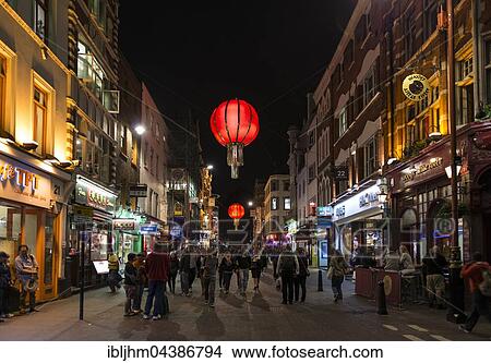 Picture - Pedestrians on Wardour Street, Nocturnal street scene, Chinatown, Soho, London, England, United Kingdom, Europe. Fotosearch