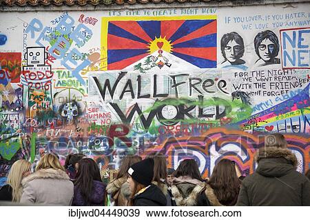Stock Photo - People visiting John Lennon Wall, Prague, Czech Republic, Europe. Fotosearch