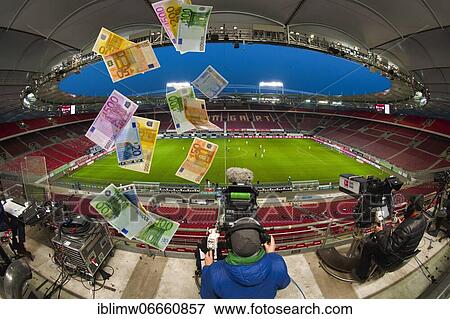 Photomontage, fight for TV money, money raining in stadium without spectators, ghost match in Bundesliga, Mercedes-Benz Arena, Corona crisis, Stuttgart, Baden-Württemberg, Germany, Europe View Large Photo Image Stock Photo - Photomontage, fight for TV money, money raining in stadium without spectators, ghost match in Bundesliga, Mercedes-Benz Arena, Corona crisis, Stuttgart, Baden-Württemberg, Germany, Europe. Fotosearch