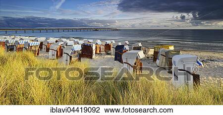 Pier and beach chairs on the coast, Binz Sea Resort, Rügen, Mecklenburg-Western Pomerania, Germany, Europe View Large Photo Image Stock Image - Pier and beach chairs on the coast, Binz Sea Resort, Rügen, Mecklenburg-Western Pomerania, Germany, Europe. Fotosearch