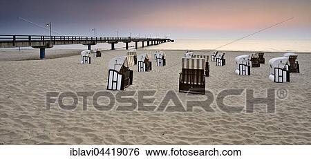 Pier and chairs on beach, morning light, Bansin, Usedom, Mecklenburg-Western Pomerania, Germany, Europe View Large Photo Image Stock Photograph - Pier and chairs on beach, morning light, Bansin, Usedom, Mecklenburg-Western Pomerania, Germany, Europe. Fotosearch