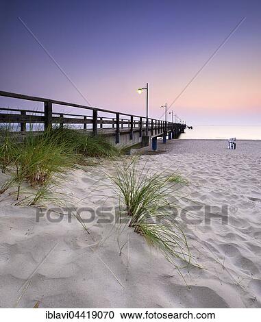 Stock Image - Pier on beach, sunrise, Bansin, Usedom, Mecklenburg-Western Pomerania, Germany, Europe. Fotosearch