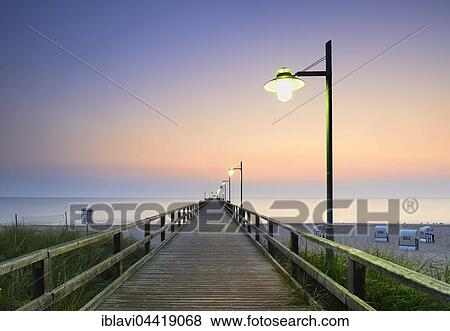Stock Photo - Pier on beach, sunrise, Bansin, Usedom, Mecklenburg-Western Pomerania, Germany, Europe. Fotosearch