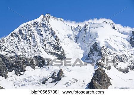 Stock Image - Piz Bernina-4049 m, Biancograt, Piz Roseg-3937 m, Grisons, Switzerland, Europe. Fotosearch