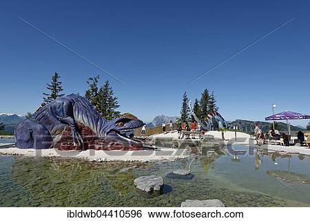 Playground and fountains at Triassic Park on Steinplatte, near Waidring, Tyrol, Austria, Europe View Large Photo Image Stock Photograph - Playground and fountains at Triassic Park on Steinplatte, near Waidring, Tyrol, Austria, Europe. Fotosearch