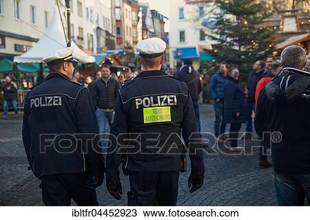 Police officers, video recording, Christmas Market, historic centre, Koblenz, Rhineland-Palatinate, Germany, Europe View Large Photo Image Stock Image - Police officers, video recording, Christmas Market, historic centre, Koblenz, Rhineland-Palatinate, Germany, Europe. Fotosearch
