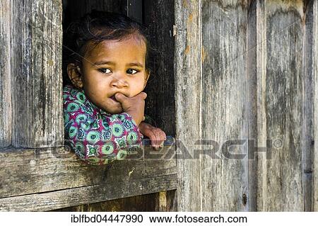 Portrait of a little girl, Upper Marsyangdi valley, looking out of a window, Bagarchap, Manang District, Nepal, Asia View Large Photo Image Stock Image - Portrait of a little girl, Upper Marsyangdi valley, looking out of a window, Bagarchap, Manang District, Nepal, Asia. Fotosearch