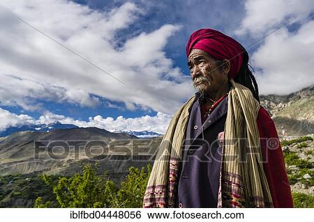 Stock Photograph - Portrait of Sadhu, holy man, looking into the himalayan mountains, Muktinath, Mustang District, Nepal, Asia. Fotosearch