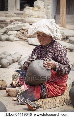 Potter at work in Potter square, Bhaktapur, Nepal, Asia View Large Photo Image Stock Photography - Potter at work in Potter square, Bhaktapur, Nepal, Asia. Fotosearch
