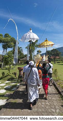 Picture - Procession of devout Buddhists with offerings, at Pura Ulun Danu Bratan water temple, Lake Bratan, Bali, Indonesia, Asia. Fotosearch